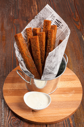 Rye croutons in a paper bag photo