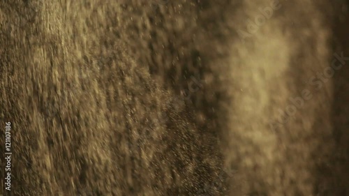 Reali particelle di polvere in caduta libera con sfondo nero. photo