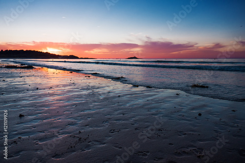 Beautiful seascape and low tide during sunset in France