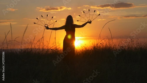 Fire performer dances with burning fire torches