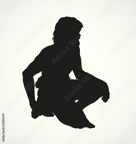 Vector picture. Primitive man draws on stone wall of cave