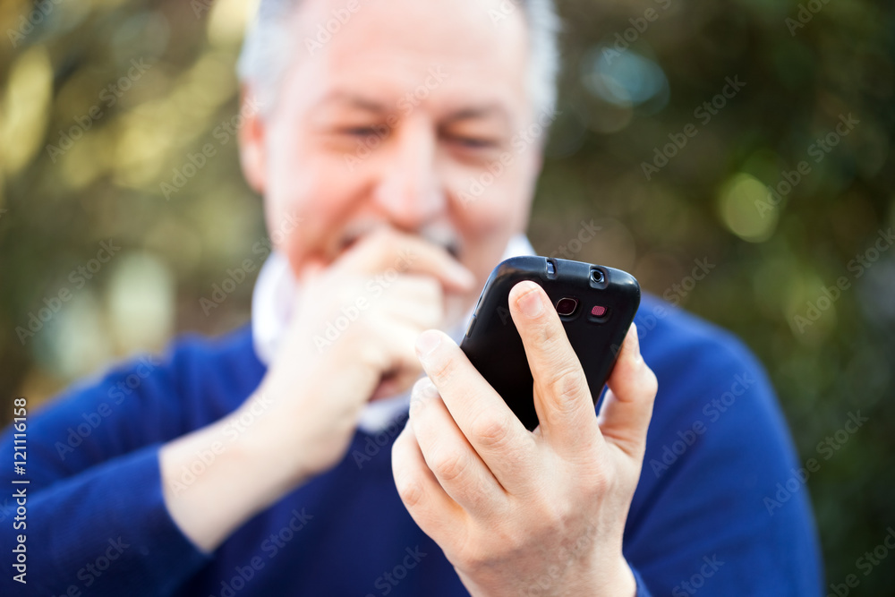 Mature man using a mobile phone