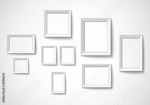 Blank art frame set isolated on wall Vector