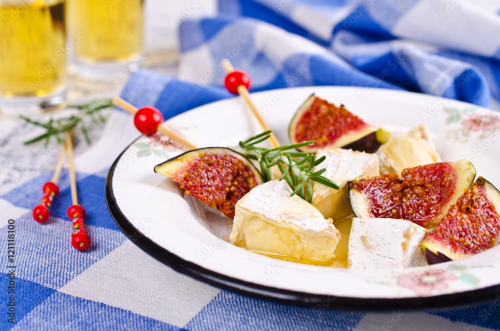 Pieces of Camembert and figs