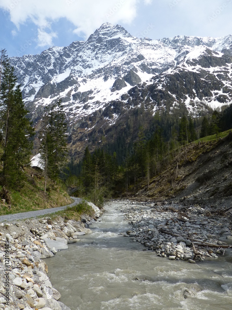View of the snow-covered Sackhorn mountain and the Kander river in the Gasterntal valley, Switzerland in late Spring View of the snow-covered Sackhorn mountain and the Kander river in the Gasterntal valley, Switzerland in late Spring