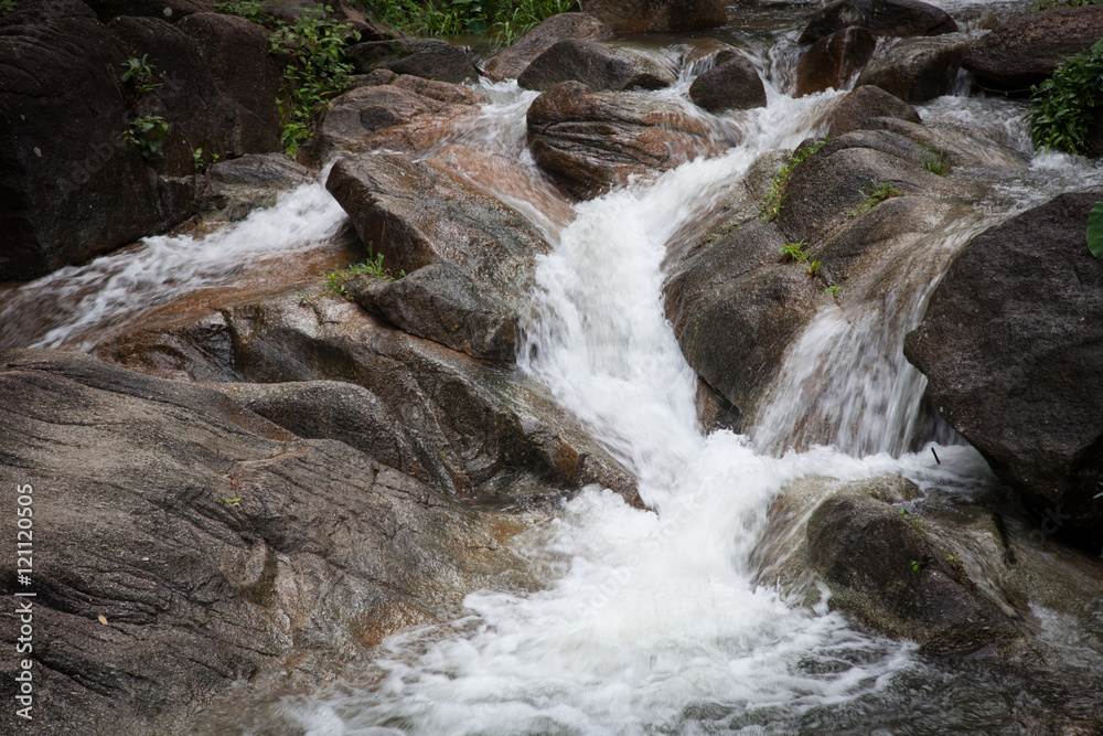 Mountain waterfall among stones . Mountain waterfall among stones .