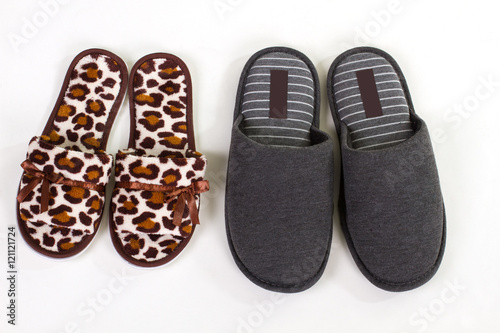 Women's and men's slippers on a white background.