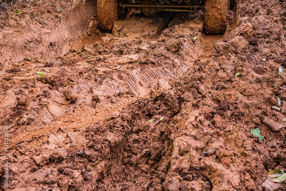Fototapeta premium Tire tracks on a muddy road.