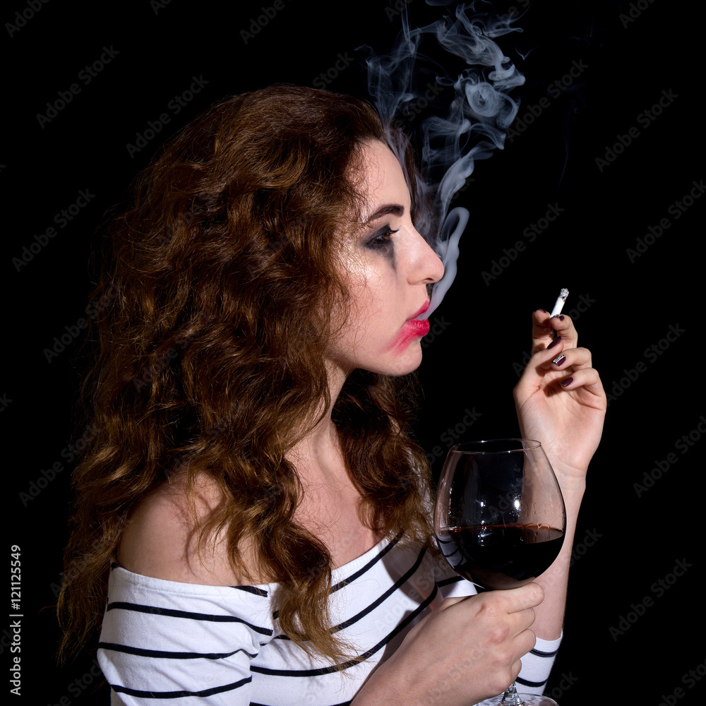 Fototapeta premium depression and addiction concept - crying sad woman drinking win