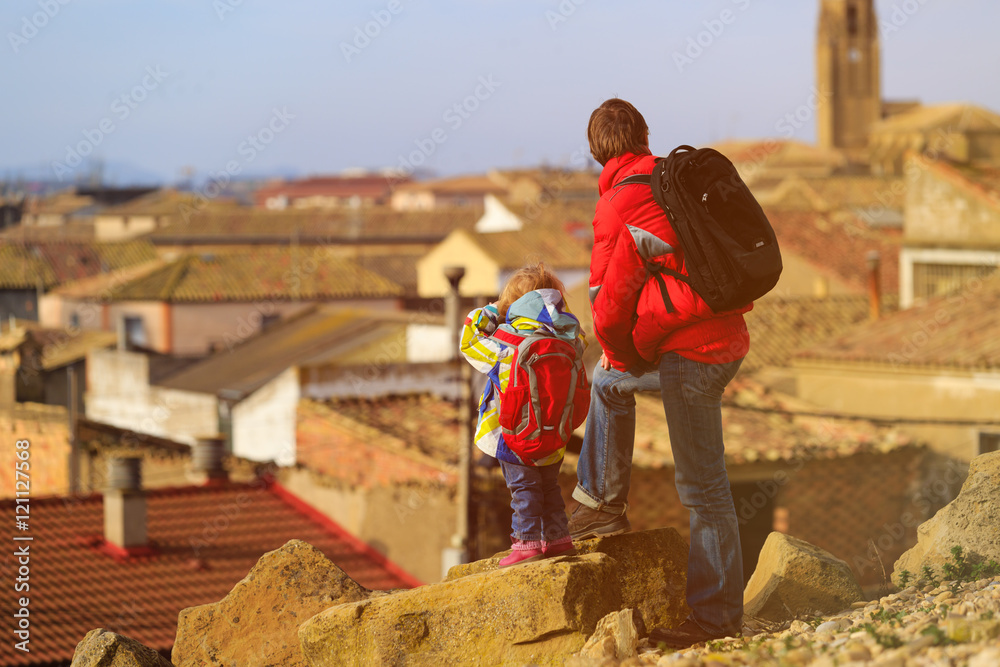 Family travel - father and daughter looking at europe city