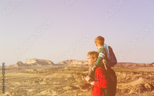 father and little son travel in mountains