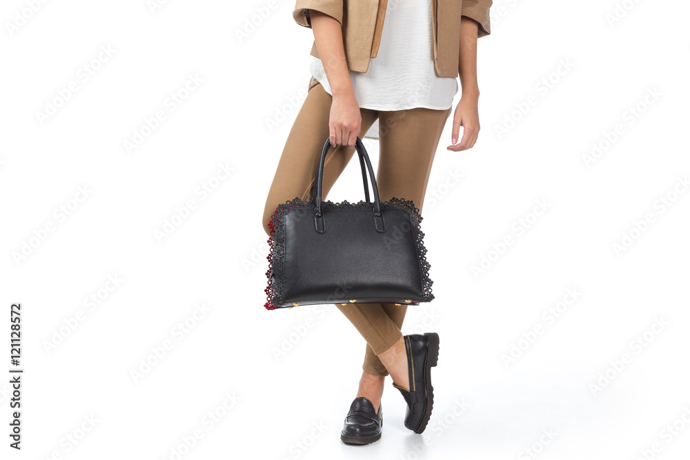 Woman holding a handbag isolated on white background Woman holding a handbag isolated on white background