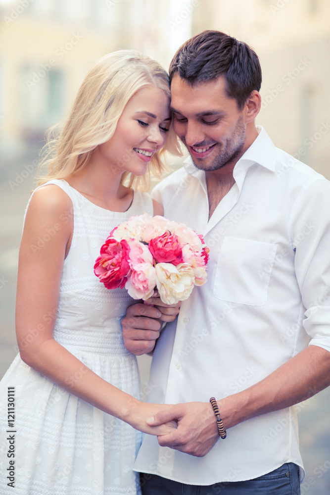 couple with flowers in the city couple with flowers in the city