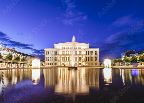 Germany, Leipzig, view to lighted opera at twilight photo