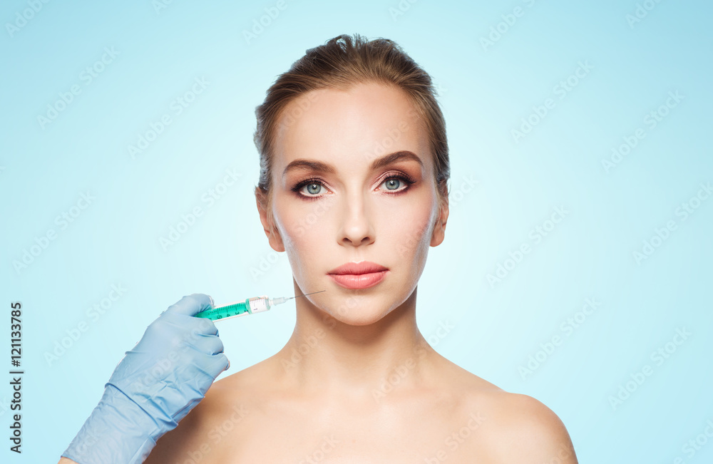 woman face and hand with syringe making injection woman face and hand with syringe making injection
