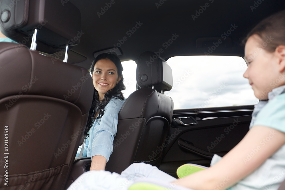 happy family with little child driving in car