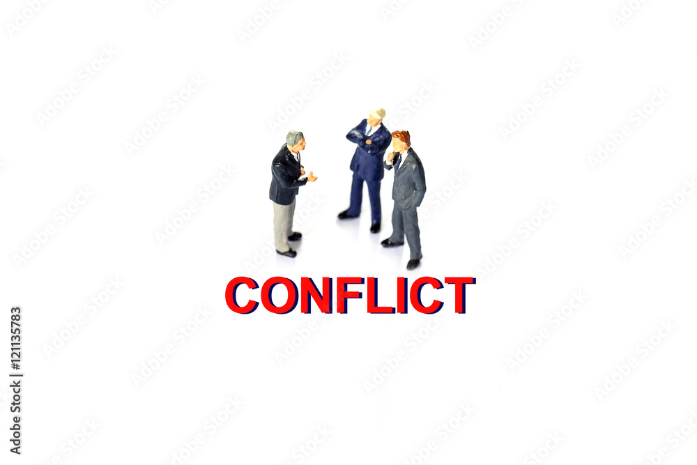 Miniature businessman with conflict concept Miniature businessman with conflict concept