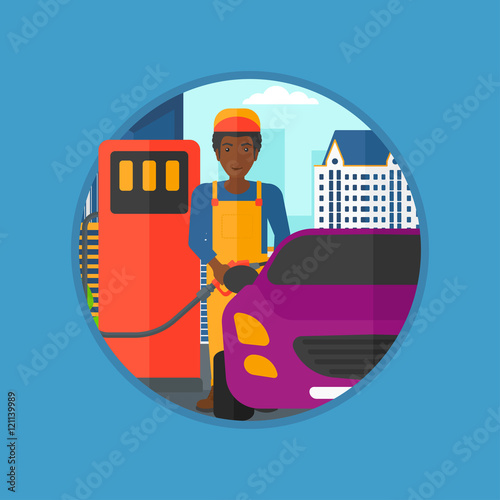 Worker filling up fuel into car.