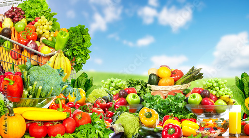 Fototapeta Naklejka Na Ścianę i Meble -  Vegetables and fruits over blue sky background.