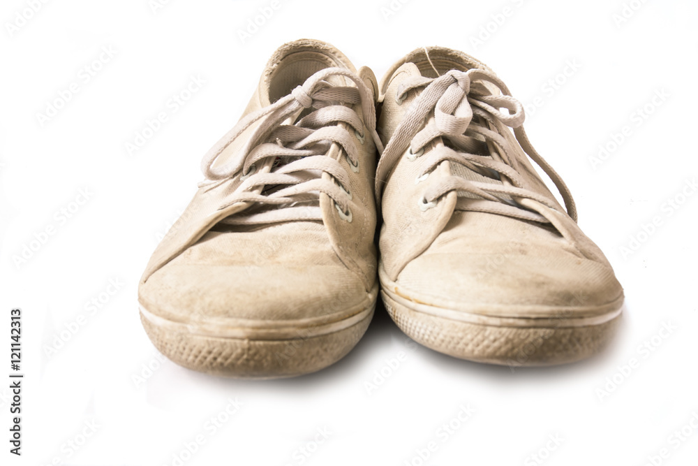 close up old sneakers on white background.
close up old sneakers on white background.