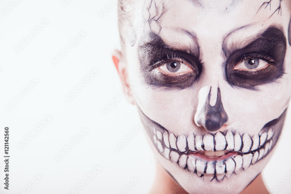 Girl with Halloween face art on white background Girl with Halloween face art on white background