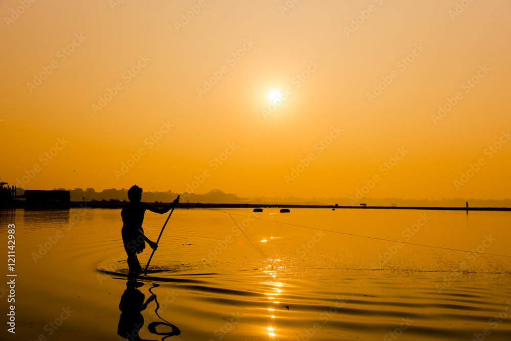 Silhouette Fisherman near U Bein bridge in Amarapura,Mandalay , Silhouette Fisherman near U Bein bridge in Amarapura,Mandalay ,