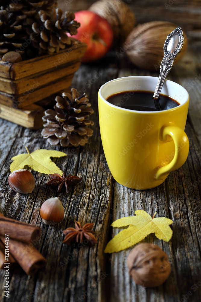Cup of coffee, nuts and pine cones