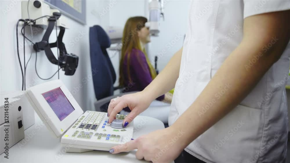 Doctor setting Phoropter device on female customer 4K Doctor setting Phoropter device on female customer 4K