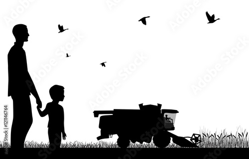 Man with a boy watching to work of combine-harvester