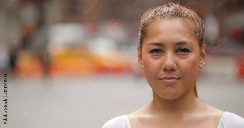 Young Latina woman in city face portrait - obrazy, fototapety, plakaty 