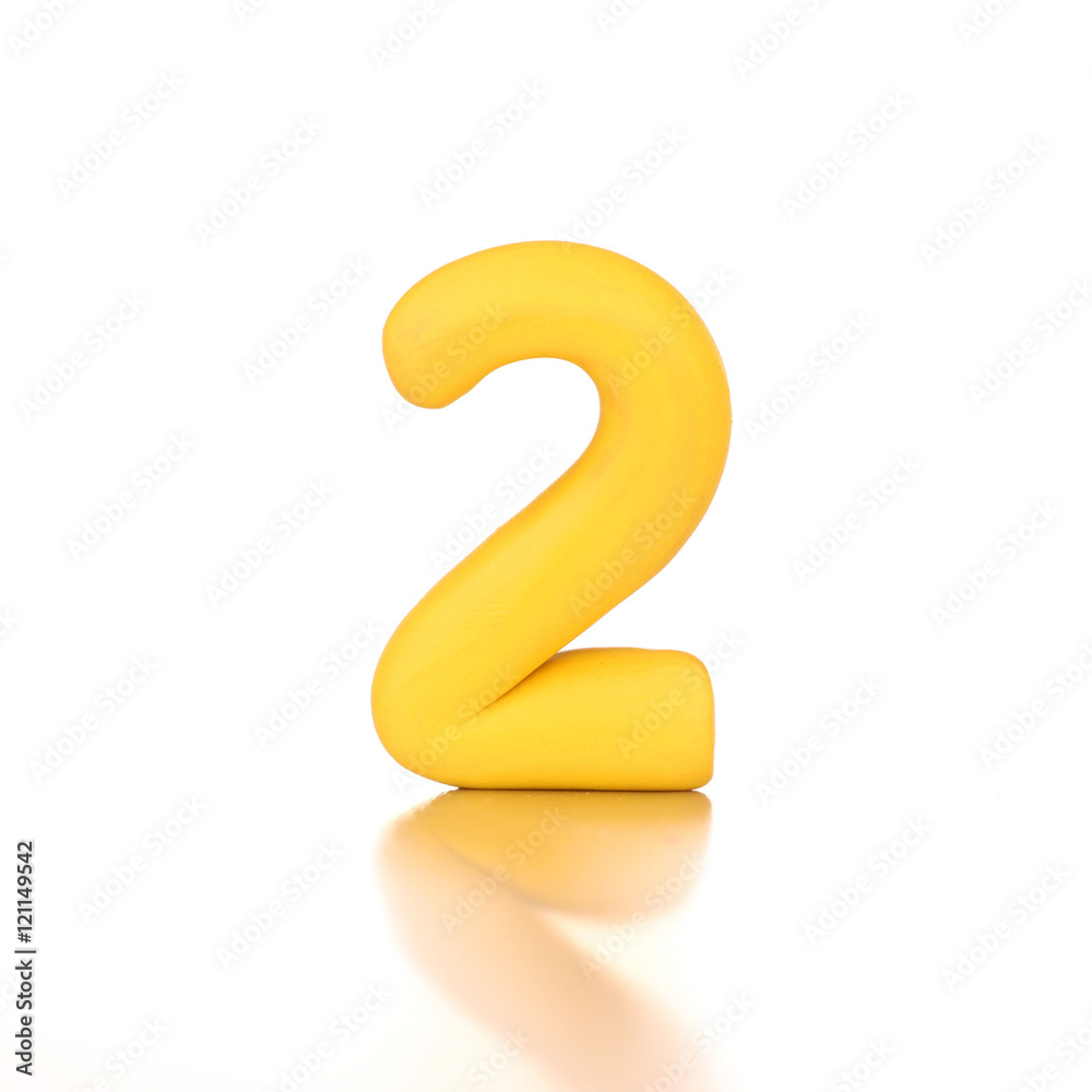 number two 2 made of yellow plasticine isolated number two 2 made of yellow plasticine isolated