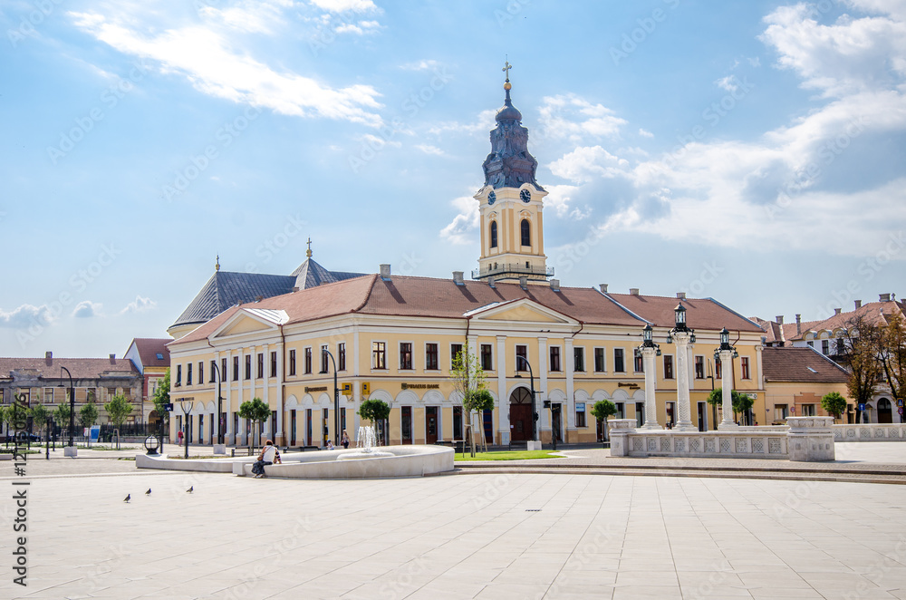 Naklejka premium 10 September 2016 - Oradea, Romania: Unirii Square with the Kovats House built in classicist architectural style and the tower from the Greek Catholic Christian Baroque Church