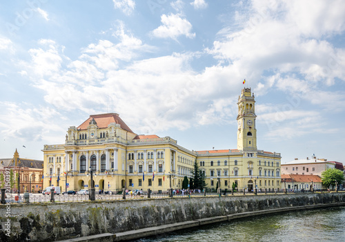 10 September 2016 - Oradea, Romania: City town hall Palace built in eclectic architectural style on the side of the Crișul Repede river