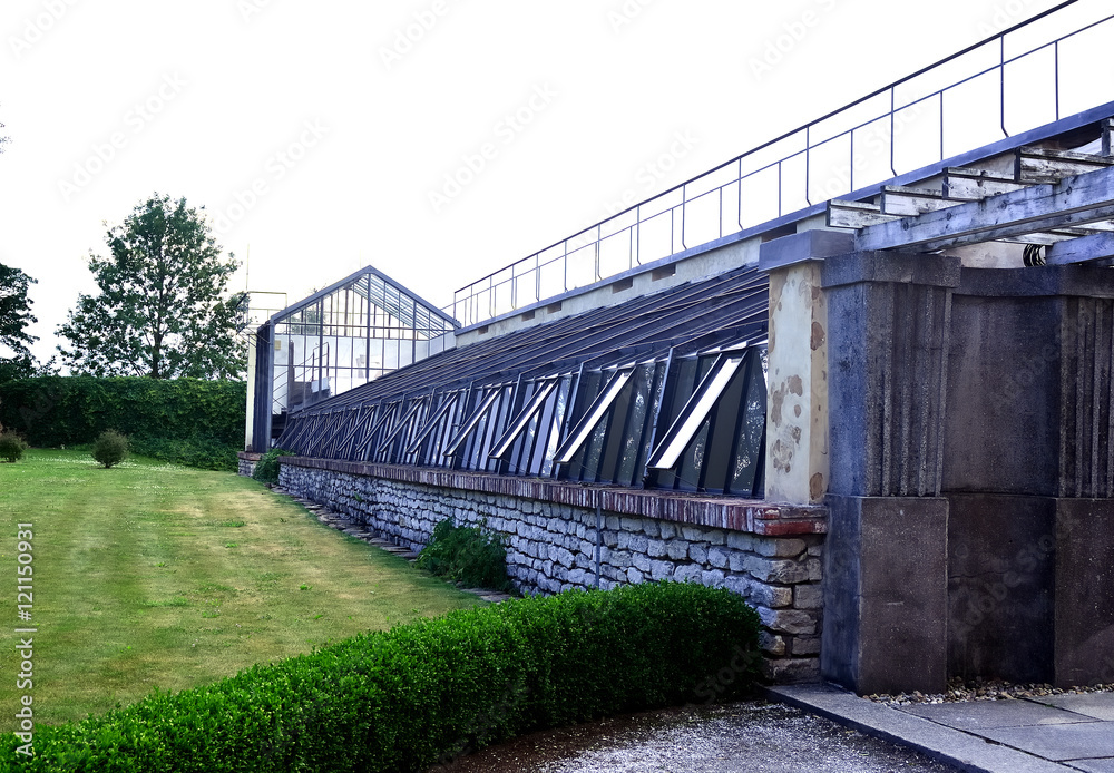 Greenhouse / Greenhouse with a tower in the steamy summer evening
in Ratbor in Czech Republic. Greenhouse / Greenhouse with a tower in the steamy summer evening
in Ratbor in Czech Republic.