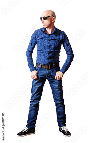 Slika na platnu Skinhead man in sunglasses and blue jeans