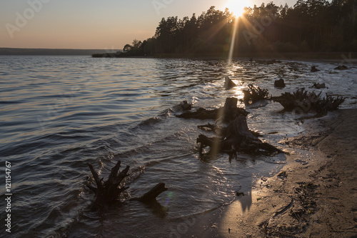 Sunset by the lake. Autumn evening by Sura reservoir, Russia. photo