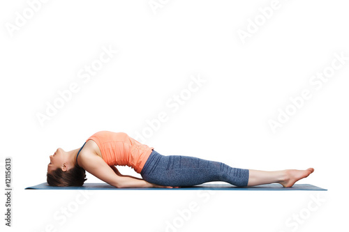 Beautiful sporty fit yogi girl practices yoga asana Matsyasana photo