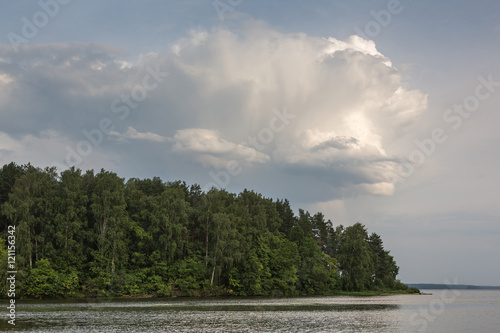 Storm cloud over the lake after the rain. Summer evening by Sura reservoir, Russia. © Oleg Anisimov