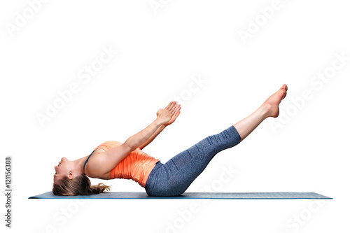 Sporty fit woman practices yoga asana Uttana padasana photo