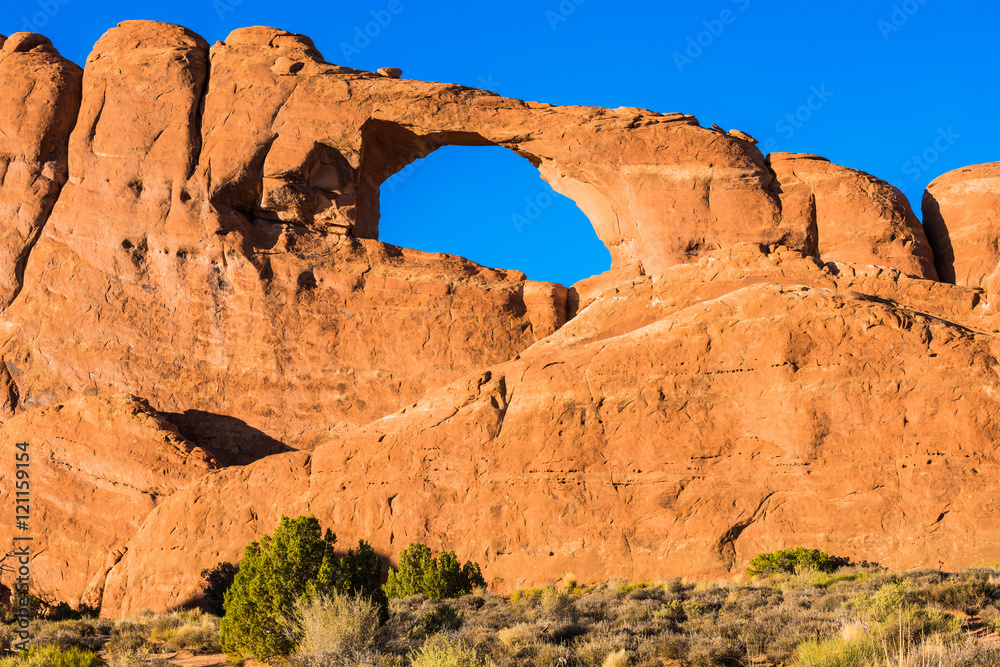 Canyons at Arches National Park with Skyline Arch during sunset