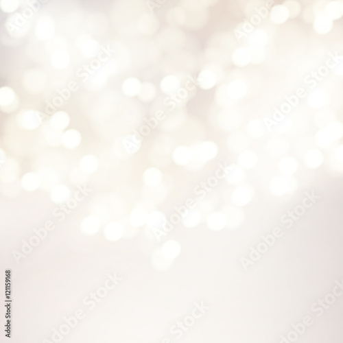 Vector bokeh background. Festive defocused white lights. Abstract blurred illustration.