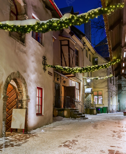 Night, holiday lane (Katarina) of the old Tallinn. Colorful, old houses. Empty street. Estonia. Winter.