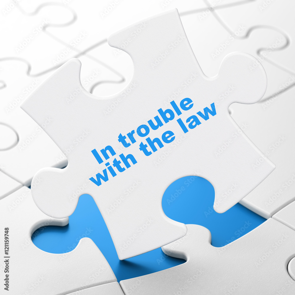 Law concept: In trouble With The law on puzzle background Law concept: In trouble With The law on puzzle background