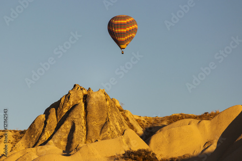 Colorful hot air balloons flying over Red valley at Cappadocia,