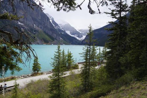 LAKE LOUISE, CANADA - MAY 28, 2016: View of the famous lake Louise. Lake Louise is the second most-visited destination in the Banff National Park. photo