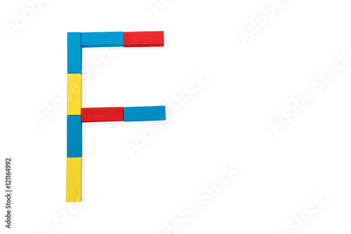 Letter F is folded of wooden blocks