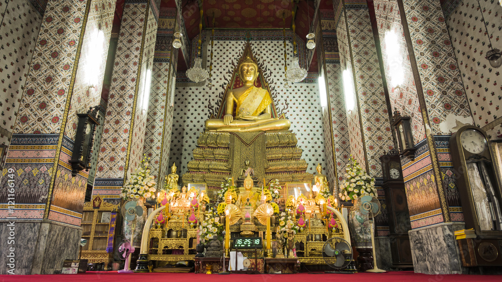Buddha gold statue and thai art architecture in Wat Arun buddhist temple( Publice temple) In Bangkok ,Thailand.