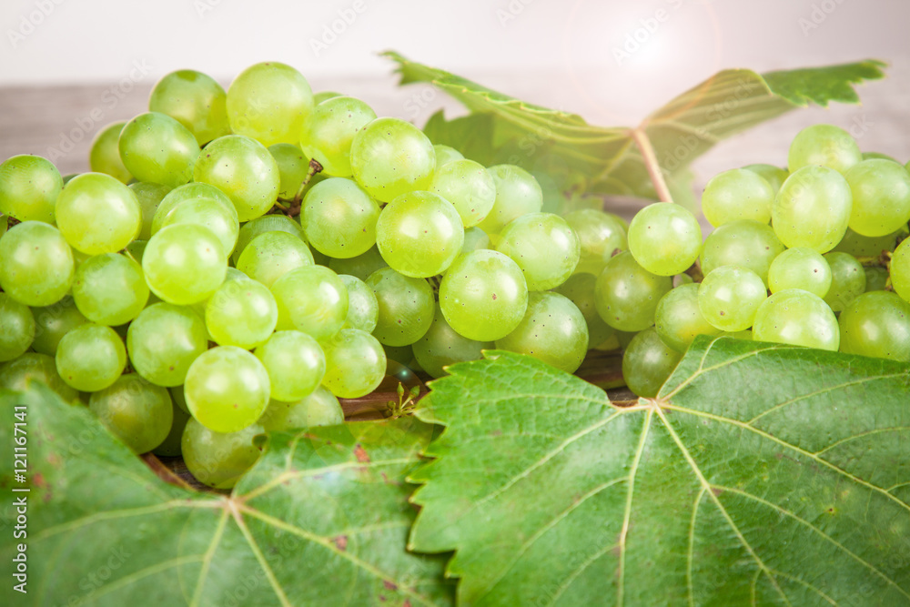 grapes, white wine on a wooden table