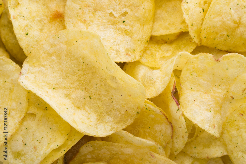 Close up potato chips on top view background.
