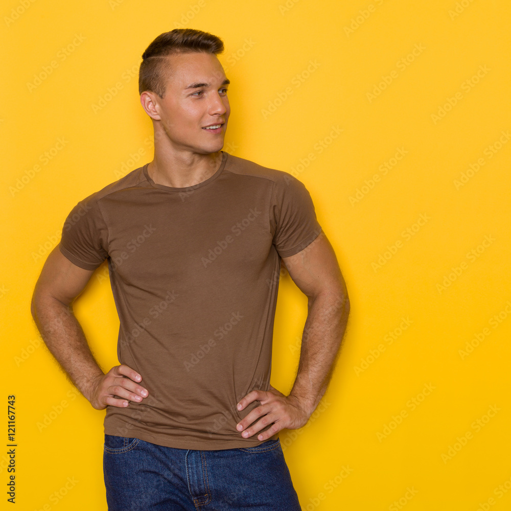 Handsome Man In Brown T-shirt Looking Away Handsome Man In Brown T-shirt Looking Away